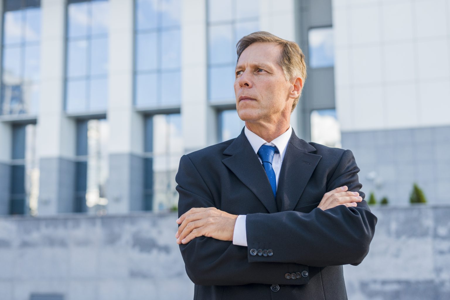 Close Up Mature Businessman With Crossed Arms